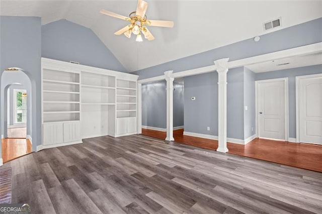 2333 Old Newnan Rd, Carrollton, GA 30116 - unfurnished living room with ceiling fan, wood finished floors, high vaulted ceiling, and arched walkways