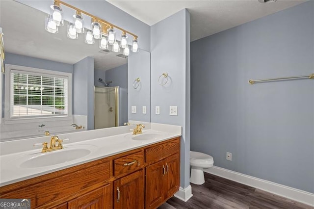 2333 Old Newnan Rd, Carrollton, GA 30116 - full bathroom featuring double vanity, a shower with door, and wood finished floors