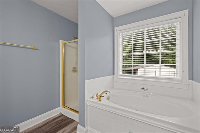 2333 Old Newnan Rd, Carrollton, GA 30116 - full bathroom featuring a shower stall, a garden tub, and wood finished floors