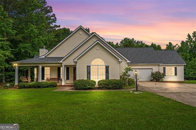 2333 Old Newnan Rd, Carrollton, GA 30116 - ranch-style home with driveway, covered porch, a lawn, a garage, and a chimney