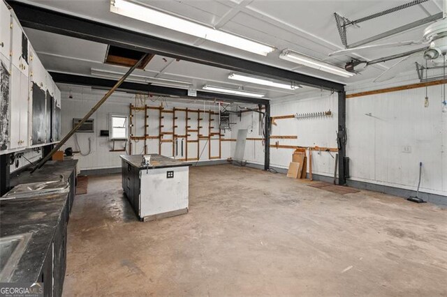 2333 Old Newnan Rd, Carrollton, GA 30116 - garage with a garage door opener and a workshop area