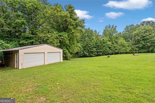 2333 Old Newnan Rd, Carrollton, GA 30116 - view of green lawn with an outdoor structure and a garage
