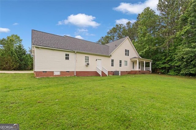 2333 Old Newnan Rd, Carrollton, GA 30116 - rear view of property featuring crawl space, a yard, a shingled roof, and entry steps