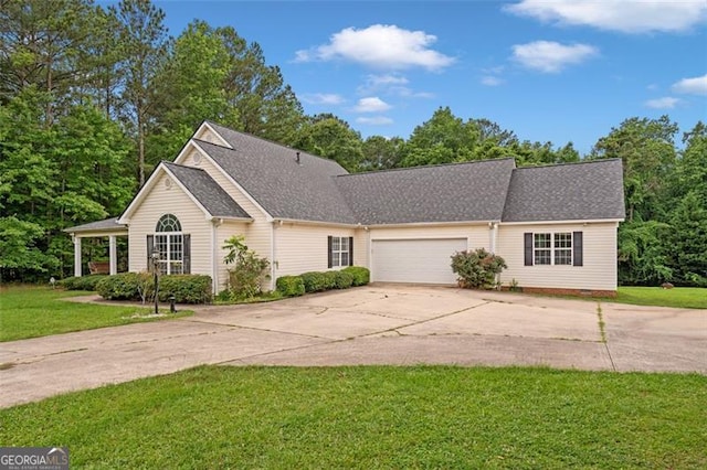 2333 Old Newnan Rd, Carrollton, GA 30116 - view of front facade featuring driveway, a front lawn, an attached garage, roof with shingles, and crawl space