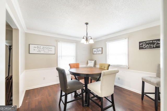 632 Chastain Pl, Macon, GA 31210 - dining space with a textured ceiling, healthy amount of natural light, crown molding, dark wood-type flooring, and a chandelier