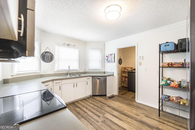 632 Chastain Pl, Macon, GA 31210 - kitchen featuring stainless steel dishwasher, a textured ceiling, crown molding, stove, and white cabinetry
