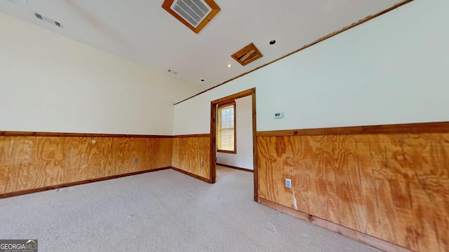 26 Ben Blvd, Swainsboro, GA 30401 - carpeted empty room featuring wainscoting and wooden walls
