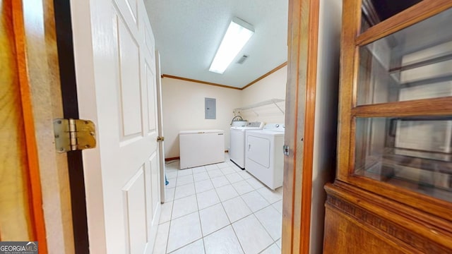 26 Ben Blvd, Swainsboro, GA 30401 - laundry area featuring washer and clothes dryer, electric panel, ornamental molding, and light tile patterned floors