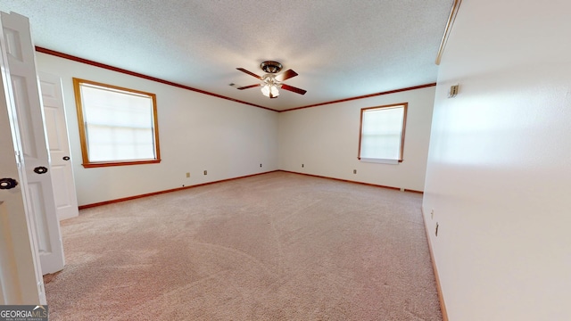 26 Ben Blvd, Swainsboro, GA 30401 - spare room with crown molding, a ceiling fan, light colored carpet, and a textured ceiling