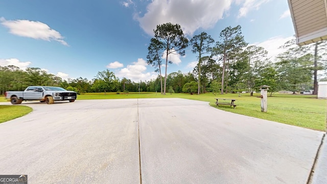 26 Ben Blvd, Swainsboro, GA 30401 - view of concrete surface with view of wooded area