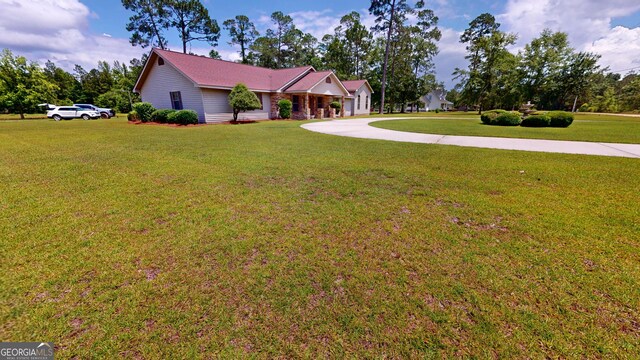 26 Ben Blvd, Swainsboro, GA 30401 - ranch-style house with a front lawn and curved driveway