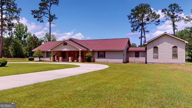 26 Ben Blvd, Swainsboro, GA 30401 - single story home with a front yard, curved driveway, and a porch