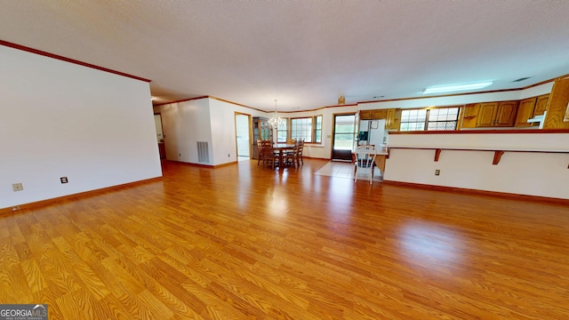 26 Ben Blvd, Swainsboro, GA 30401 - living room with light wood finished floors and crown molding
