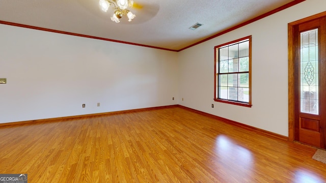26 Ben Blvd, Swainsboro, GA 30401 - spare room with plenty of natural light, light wood-type flooring, a ceiling fan, and ornamental molding