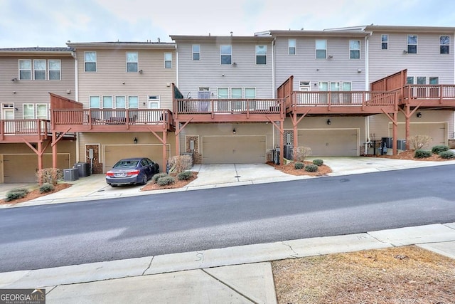 1306 Harris Way, Brookhaven, GA 30319 - back of house featuring a garage and driveway