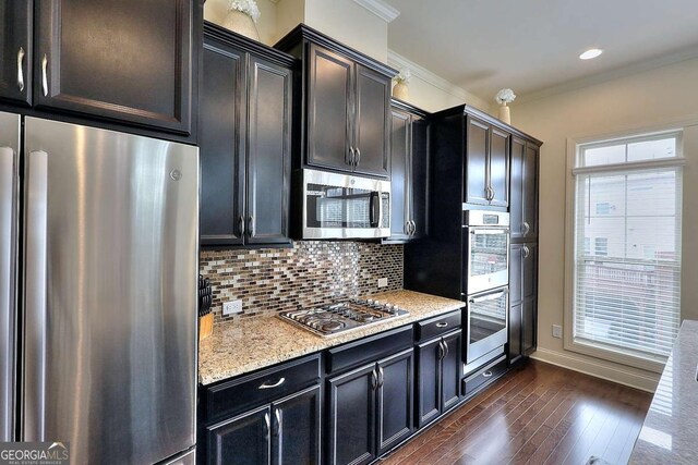 1306 Harris Way, Brookhaven, GA 30319 - kitchen with stainless steel appliances, ornamental molding, dark wood-style floors, tasteful backsplash, and light stone counters