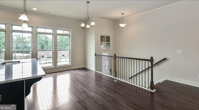 1306 Harris Way, Brookhaven, GA 30319 - unfurnished dining area with a chandelier, dark wood-style flooring, and crown molding