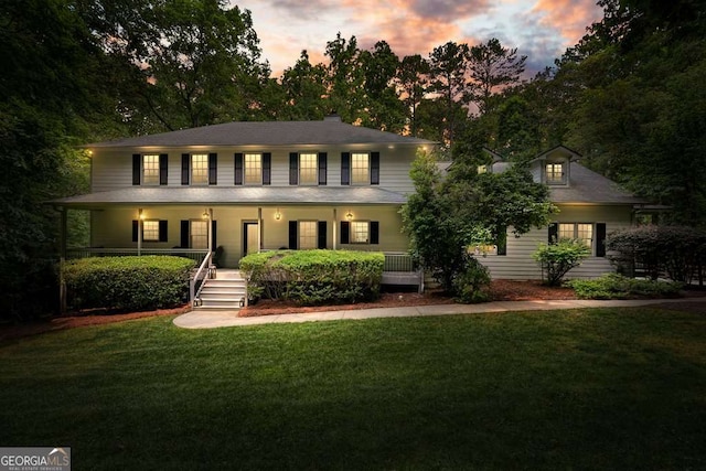 627 Apache Trl, Woodstock, GA 30189 - colonial-style house with covered porch and a yard