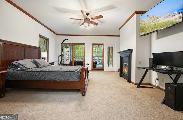 627 Apache Trl, Woodstock, GA 30189 - bedroom with carpet flooring, crown molding, a glass covered fireplace, and ceiling fan