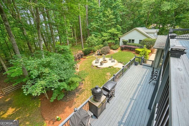 627 Apache Trl, Woodstock, GA 30189 - deck with a grill, a view of trees, and a lawn