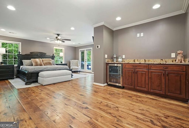 627 Apache Trl, Woodstock, GA 30189 - bedroom featuring beverage cooler, a bar, light wood finished floors, ornamental molding, and recessed lighting