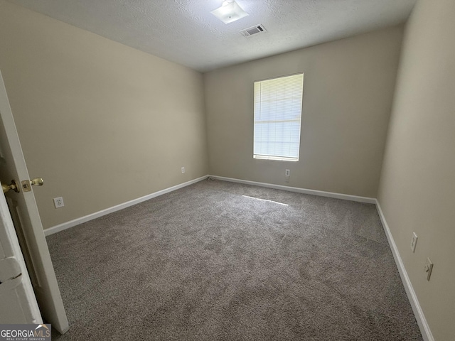 756 Glenshire Ct, Riverdale, GA 30274 - unfurnished room featuring carpet floors and a textured ceiling