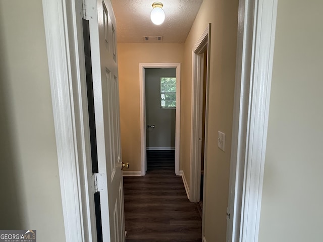 756 Glenshire Ct, Riverdale, GA 30274 - hallway with dark wood-type flooring and a textured ceiling
