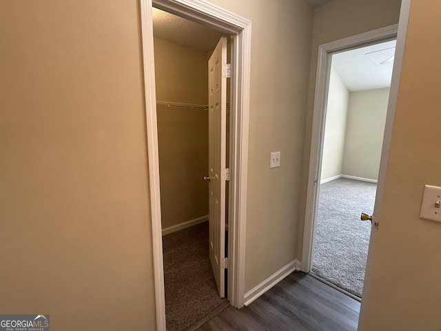 756 Glenshire Ct, Riverdale, GA 30274 - hallway featuring dark wood-style flooring and dark carpet
