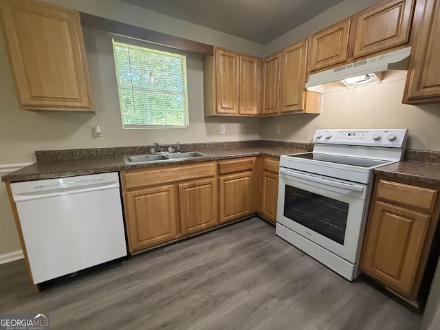 756 Glenshire Ct, Riverdale, GA 30274 - kitchen with white appliances, under cabinet range hood, dark countertops, dark wood-type flooring, and a textured ceiling