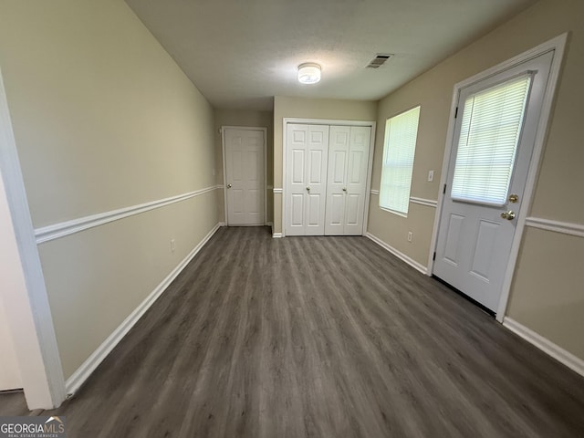 756 Glenshire Ct, Riverdale, GA 30274 - unfurnished bedroom with dark wood-type flooring and a closet