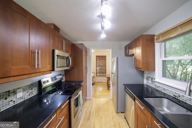 221 College Cir, Athens, GA 30605 - kitchen featuring stainless steel appliances, light wood-style floors, and brown cabinetry