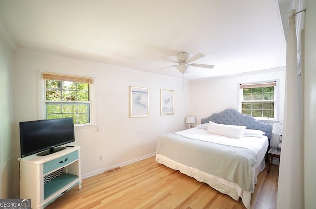 221 College Cir, Athens, GA 30605 - bedroom featuring wood finished floors, ornamental molding, and ceiling fan