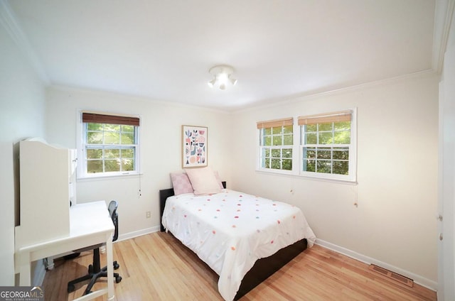 221 College Cir, Athens, GA 30605 - bedroom featuring light wood-style flooring, ornamental molding, and a desk