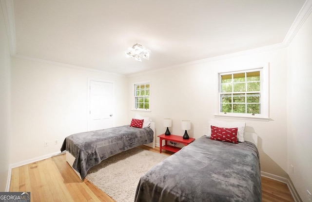 221 College Cir, Athens, GA 30605 - bedroom featuring ornamental molding and wood finished floors