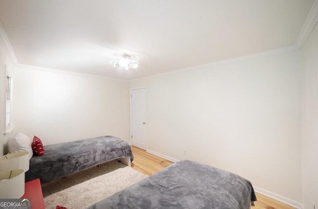 221 College Cir, Athens, GA 30605 - bedroom featuring crown molding and light wood-style floors