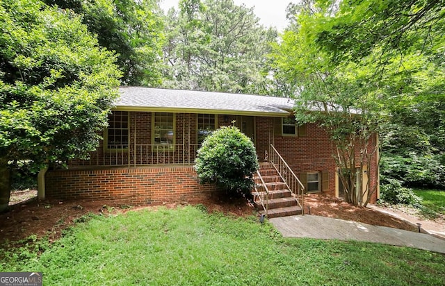 221 College Cir, Athens, GA 30605 - ranch-style home with brick siding, a front yard, and stairway