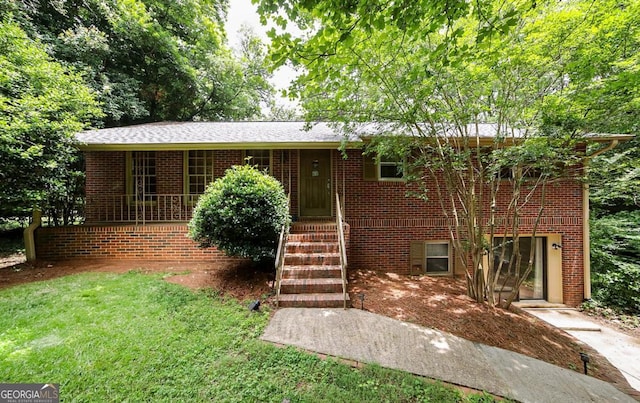 221 College Cir, Athens, GA 30605 - view of front of house with a front lawn and brick siding