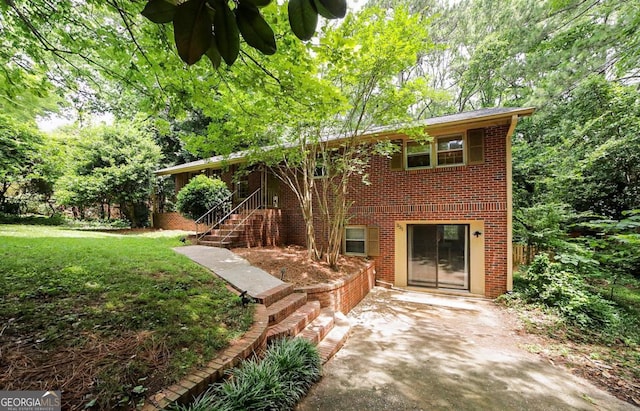 221 College Cir, Athens, GA 30605 - view of front of home featuring brick siding, a front lawn, and stairway