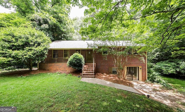 221 College Cir, Athens, GA 30605 - view of front facade featuring a front yard and brick siding