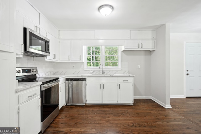 3611 Radcliffe Blvd, Decatur, GA 30034 - kitchen featuring stainless steel appliances, white cabinets, tasteful backsplash, dark wood-style flooring, and light stone countertops