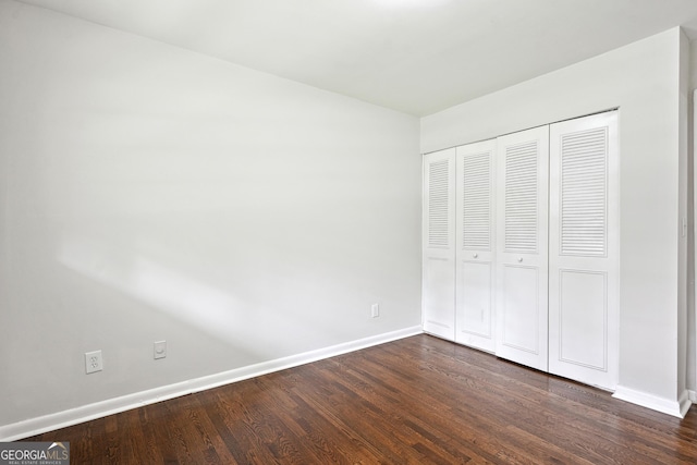 3611 Radcliffe Blvd, Decatur, GA 30034 - unfurnished bedroom featuring dark wood-style flooring and a closet