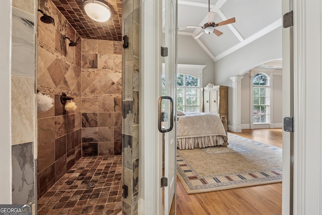 3410 Enclave Mill Ct, Dacula, GA 30019 - ensuite bathroom featuring ornate columns, a shower stall, a ceiling fan, wood finished floors, and vaulted ceiling