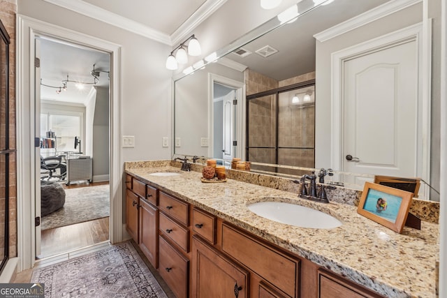 3410 Enclave Mill Ct, Dacula, GA 30019 - bathroom featuring ornamental molding, double vanity, and a stall shower