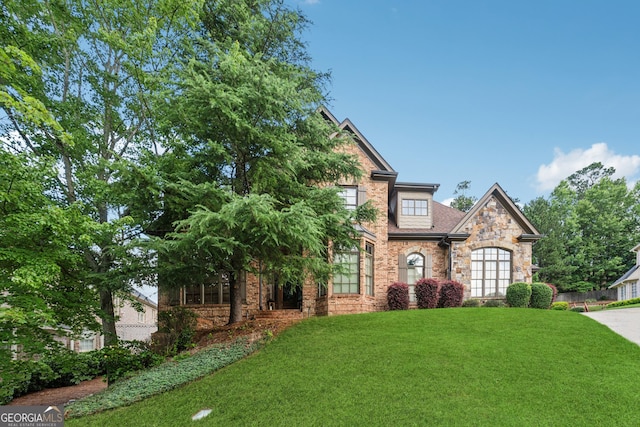 3410 Enclave Mill Ct, Dacula, GA 30019 - view of front facade featuring stone siding and a front yard