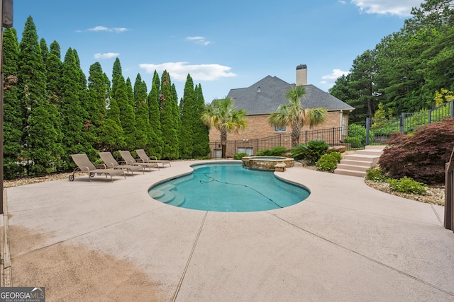 3410 Enclave Mill Ct, Dacula, GA 30019 - view of swimming pool with a patio and a pool with connected hot tub