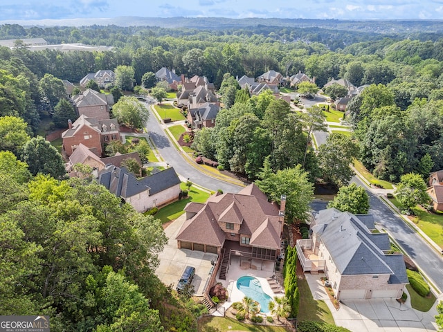 3410 Enclave Mill Ct, Dacula, GA 30019 - aerial view of residential area featuring a forest and a pool