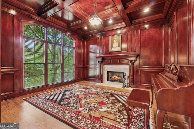 3410 Enclave Mill Ct, Dacula, GA 30019 - living area with a wooden ceiling with exposed beams, a fireplace, wood finished floors, coffered ceiling, and wooden walls