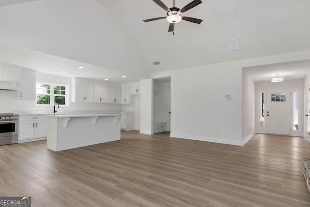 797 Ode Peppers Rd, Winder, GA 30680 - unfurnished living room featuring high vaulted ceiling, recessed lighting, light wood finished floors, and ceiling fan