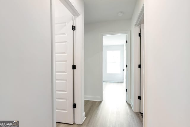 797 Ode Peppers Rd, Winder, GA 30680 - hallway featuring light wood-type flooring and baseboards