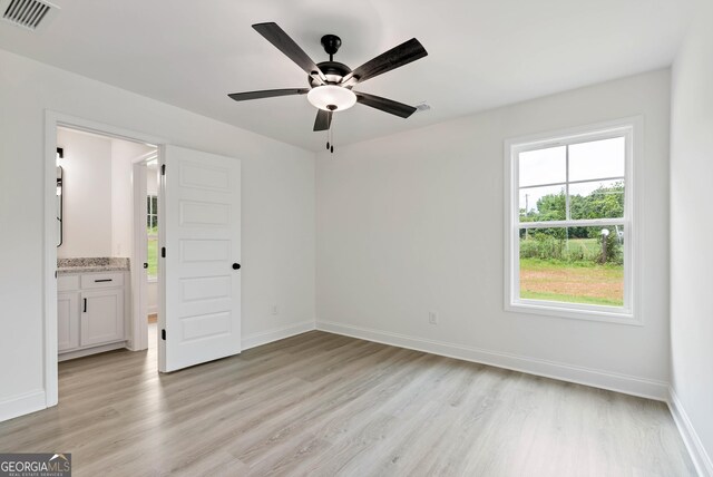 797 Ode Peppers Rd, Winder, GA 30680 - spare room featuring light wood-style flooring, plenty of natural light, and ceiling fan